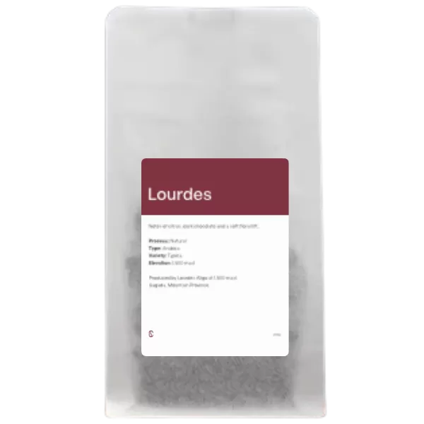A white Crimson Coffee bag of Lourdes, a natural Typica from Sagada, Mountain Province, 250g.